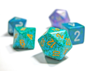 An image of a twenty sided dice with other types of dice in the background.