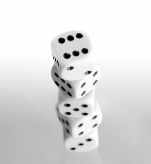 An image of four six sided die.