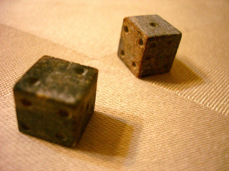 An image of old six sided die.